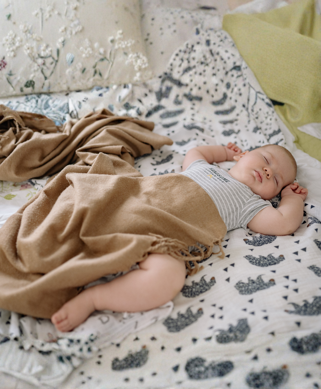 Baby sleeping peacefully in bed during sleep training routine